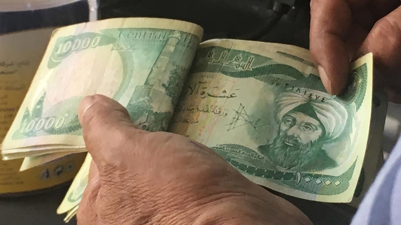 عراق بدهی خود به ایران را به جای دلار به دینار داد عراق بدهی خود به ایران را به جای دلار به دینار داد